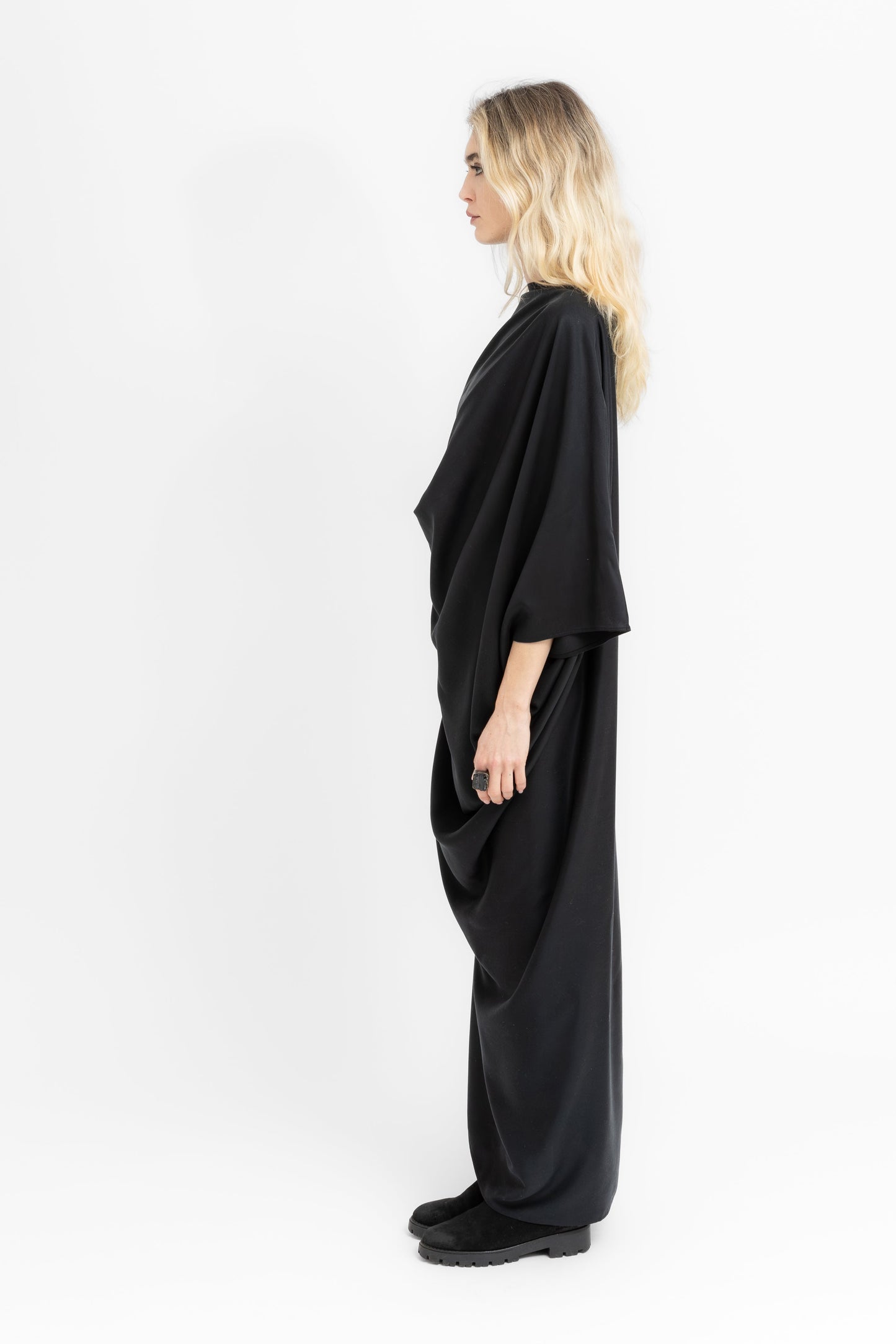 Sierra dramatic draping and flowing geometry in black