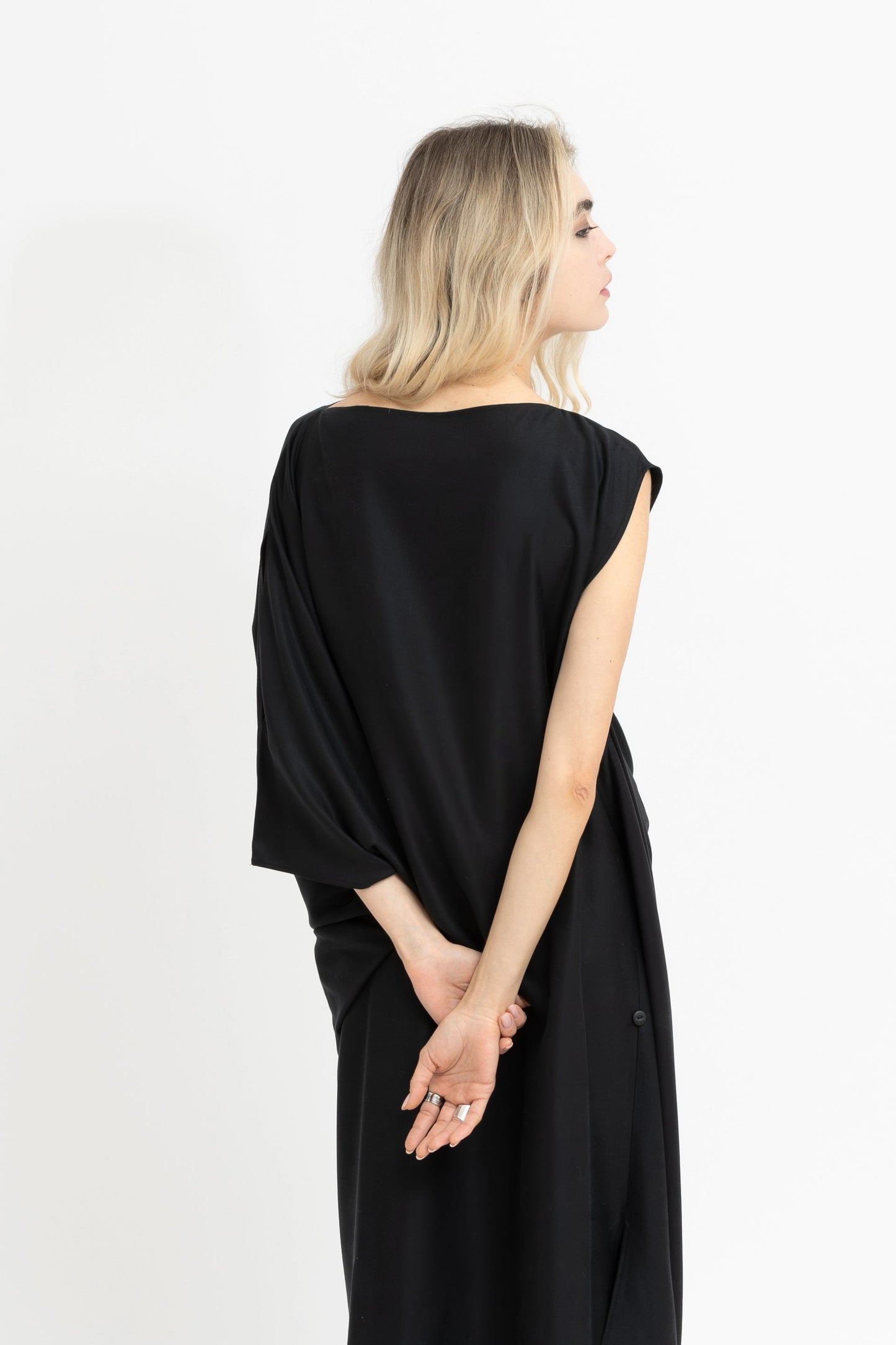 Sierra dramatic draping and flowing geometry in black