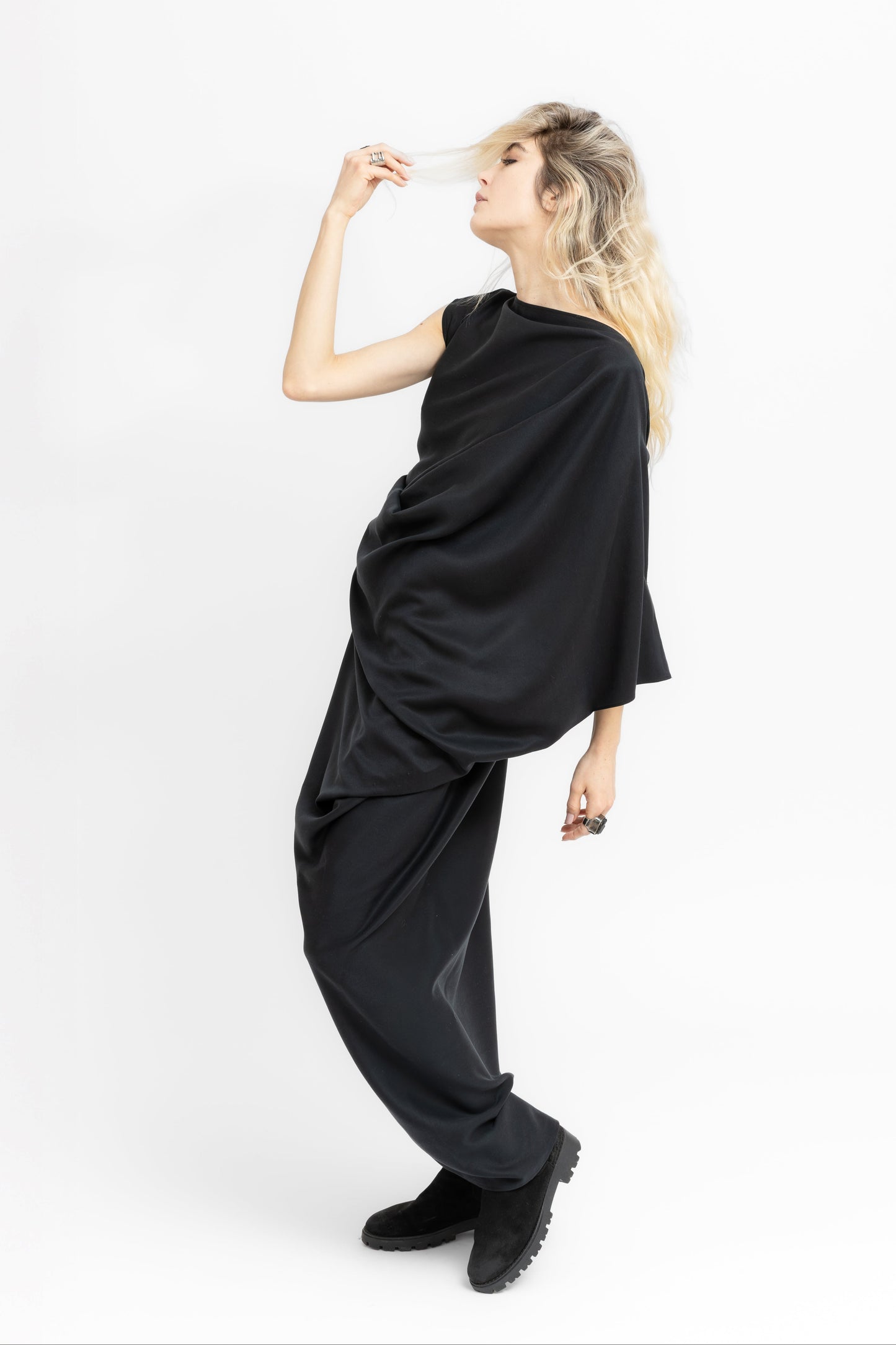 Sierra dramatic draping and flowing geometry in black