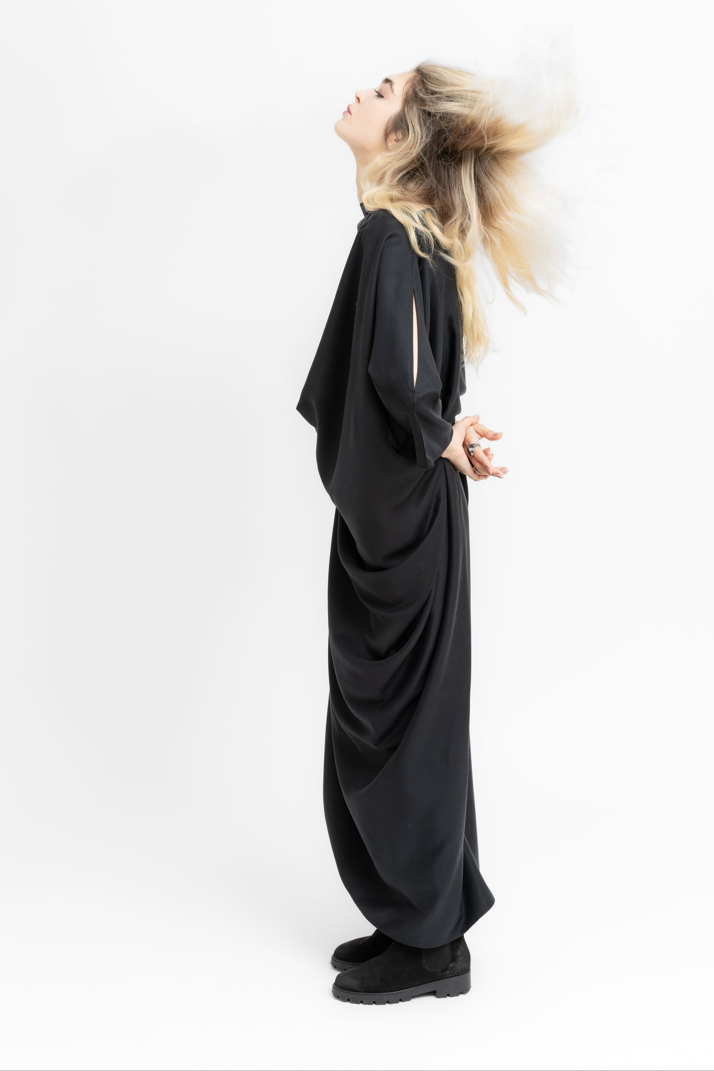 Sierra dramatic draping and flowing geometry in black