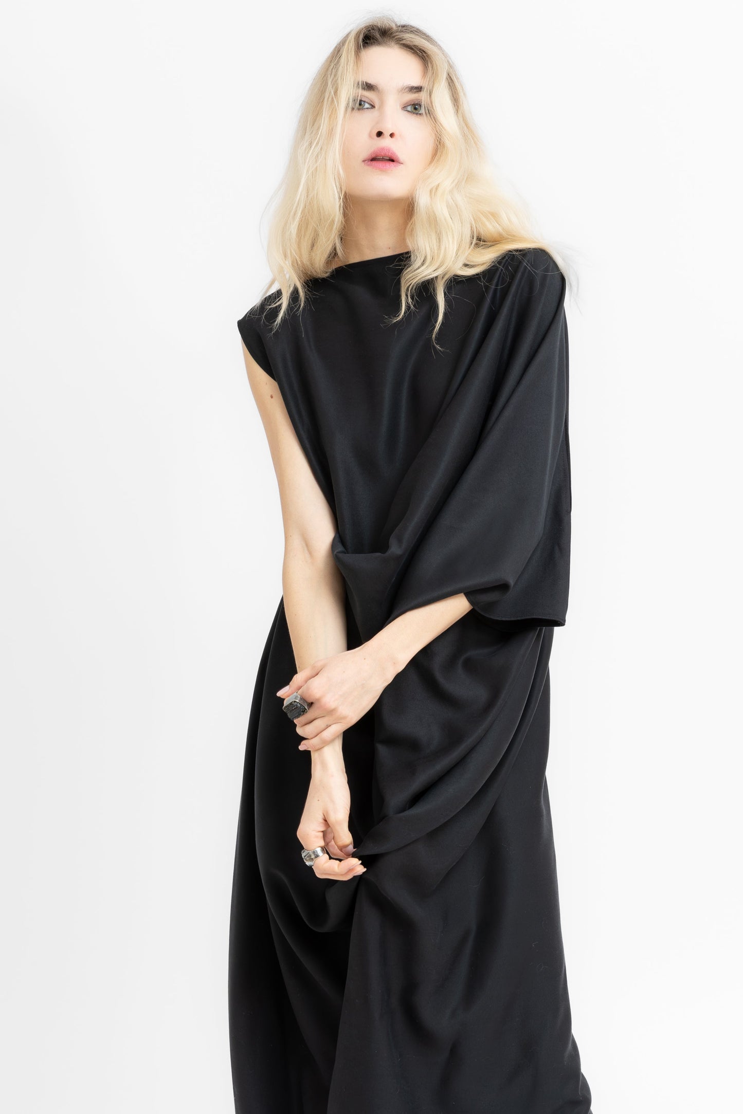 Sierra dramatic draping and flowing geometry in black