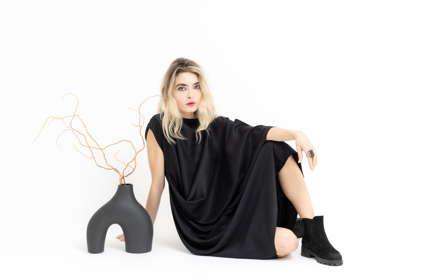 Sierra dramatic draping and flowing geometry in black