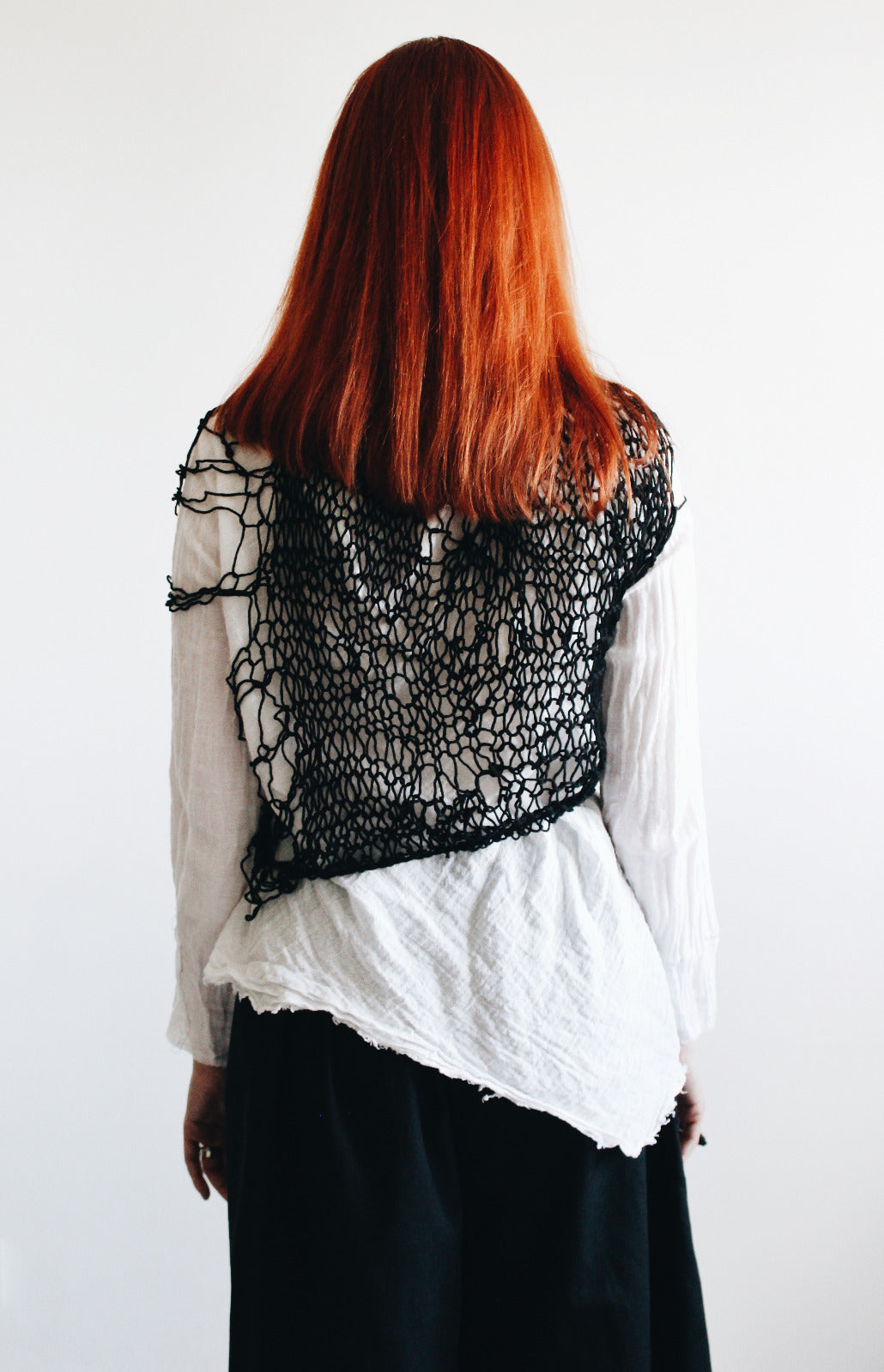 Deconstructed hand knitted avantgarde top