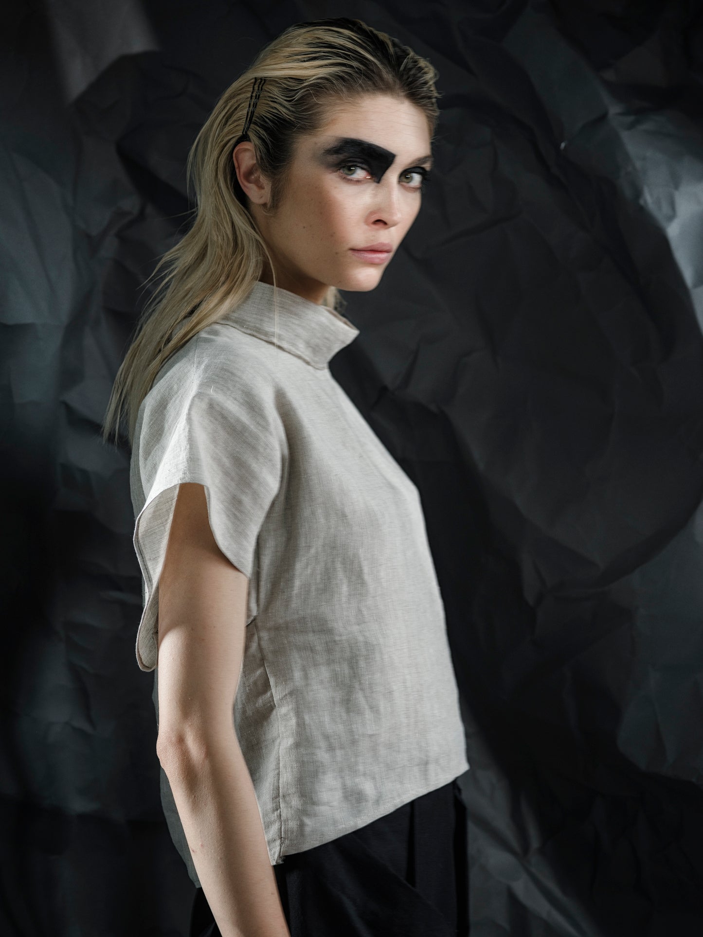 Minimalist linen crop top with a structured fit