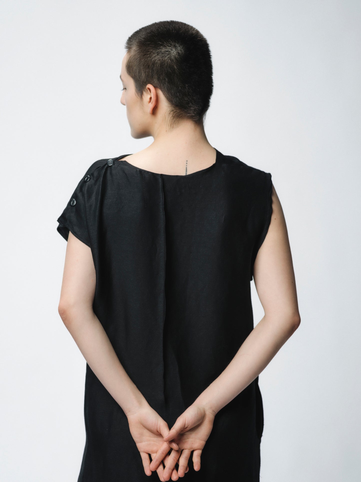 Sculptural draping linen dress with buttons closure on the shoulder