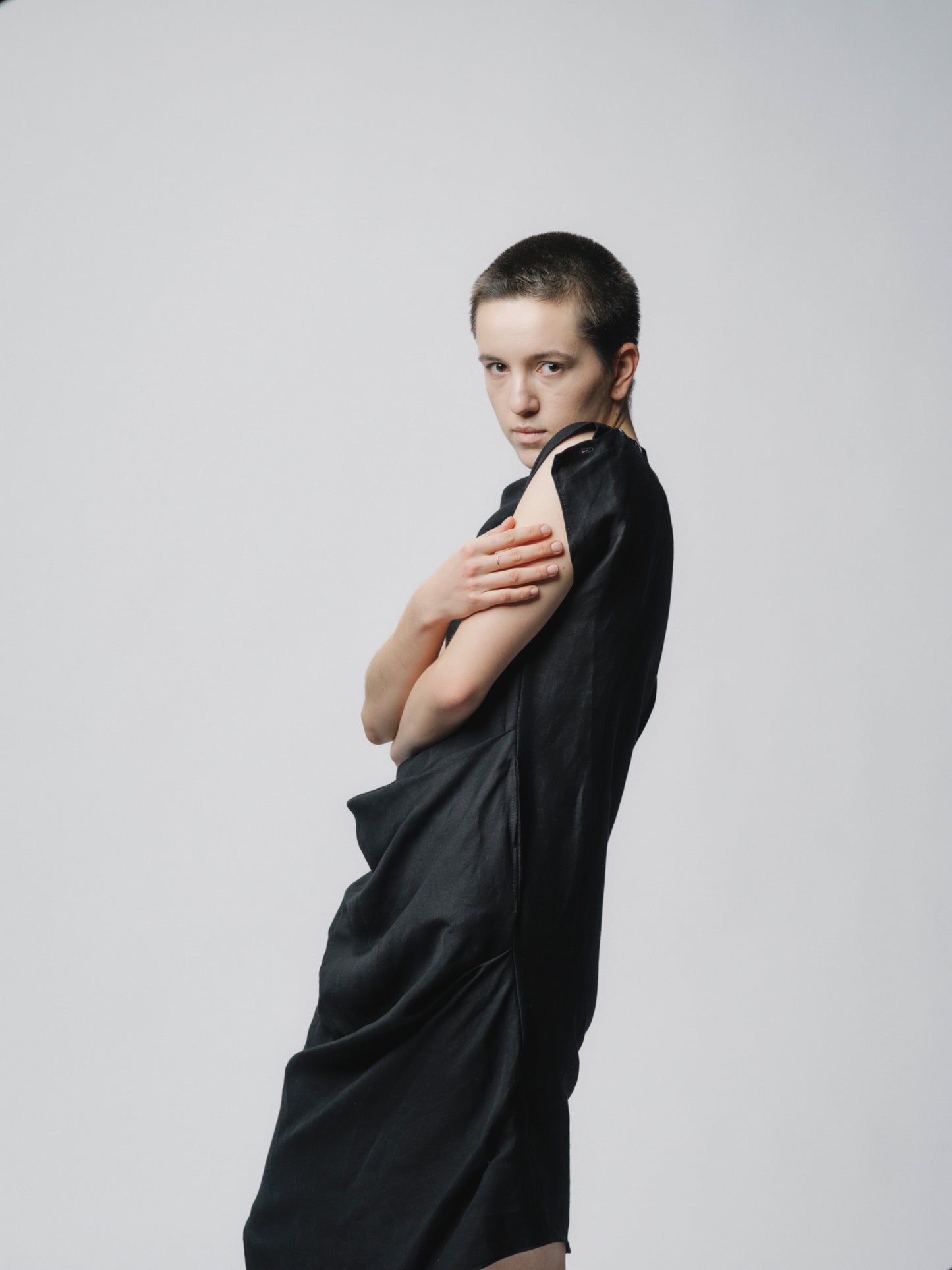 Sculptural draping linen dress with buttons closure on the shoulder